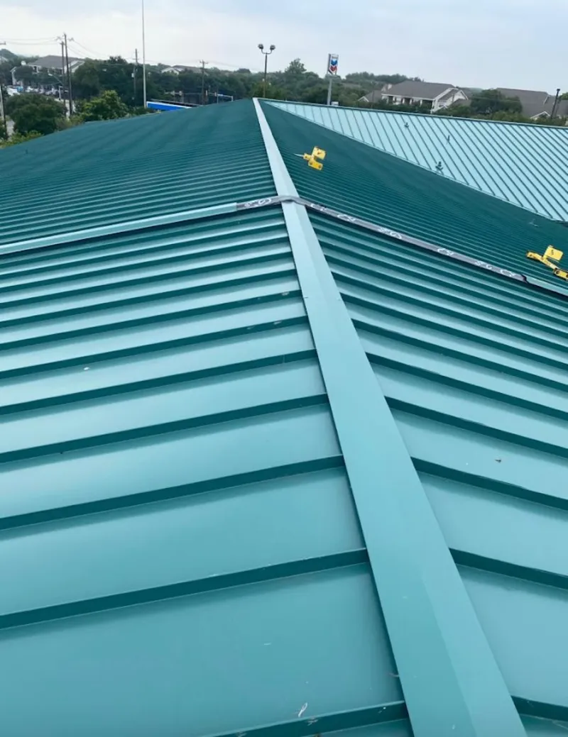 Green commercial metal roof ridge and valley for Metal Roof Repair in Huntington